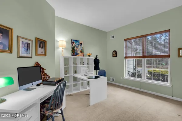 a workspace with furniture and a window