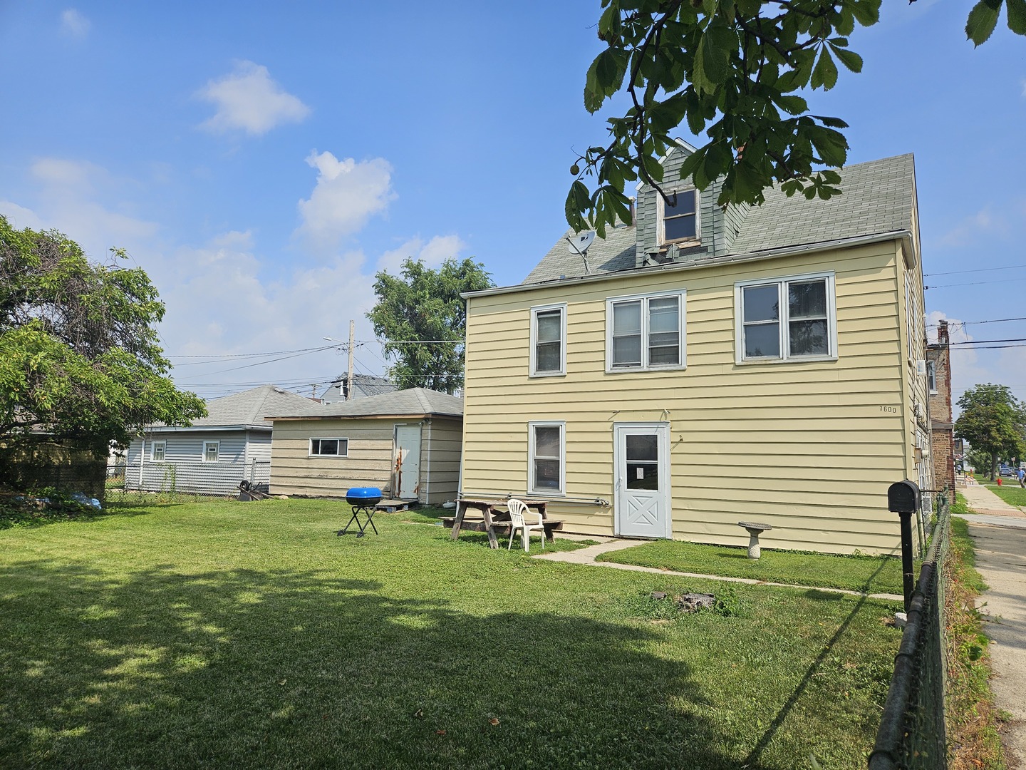 7600 West 61st Street Summit, IL 60501 - Photo 1 of 3 a front view of house with yard