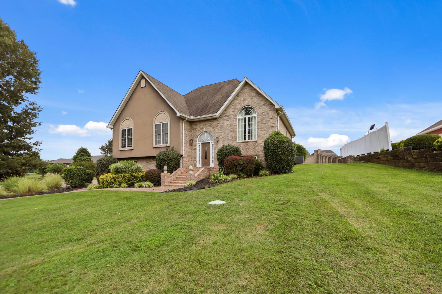 1247 Bates Road Lebanon, TN 37087 - Photo 3 of 43 a front view of a house with a garden and yard