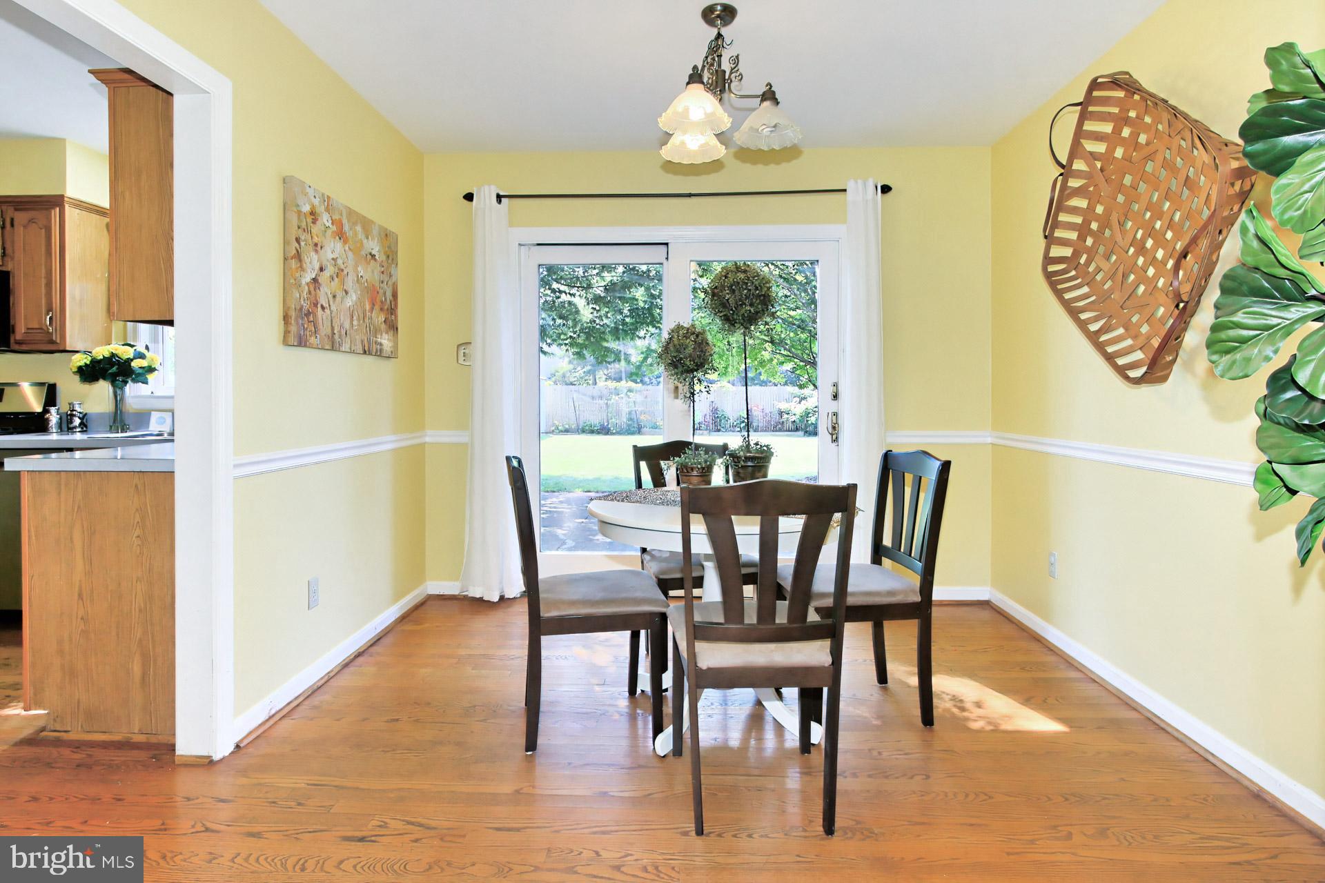 4123 Lees Corner Road Chantilly, VA 20151 - Photo 13 of 47 a view of a dining room with furniture window and wooden floor