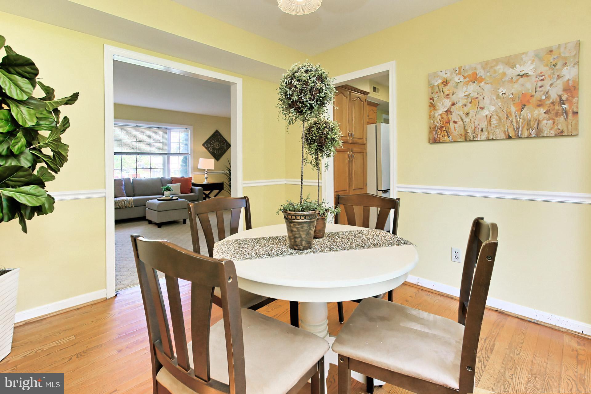 4123 Lees Corner Road Chantilly, VA 20151 - Photo 14 of 47 a view of a dining room with furniture window and wooden floor