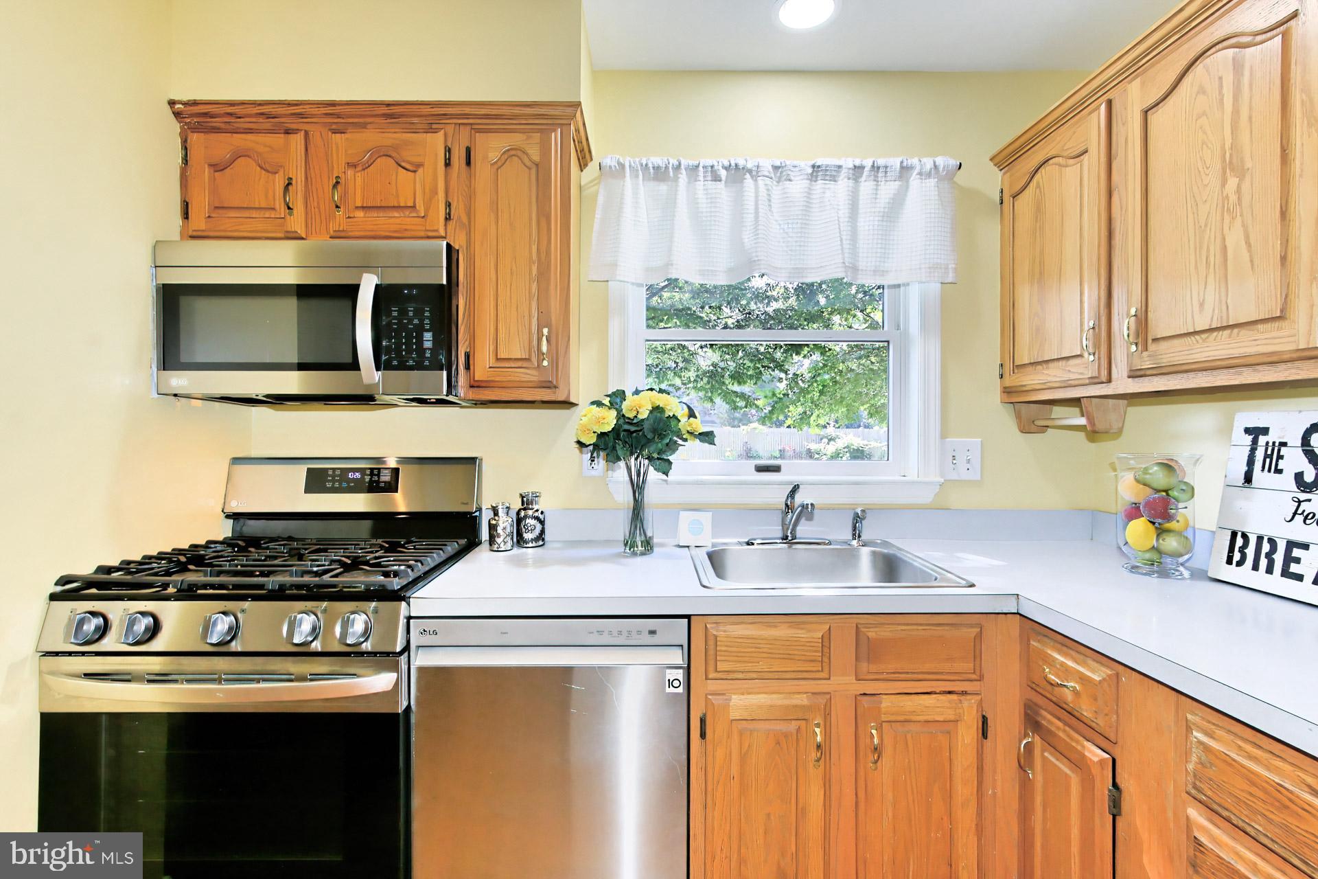 4123 Lees Corner Road Chantilly, VA 20151 - Photo 20 of 47 a kitchen with stainless steel appliances a stove a sink a cabinets and a window