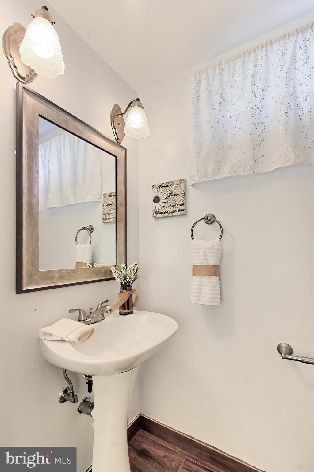4123 Lees Corner Road Chantilly, VA 20151 - Photo 22 of 47 a bathroom with a sink a mirror and a toilet