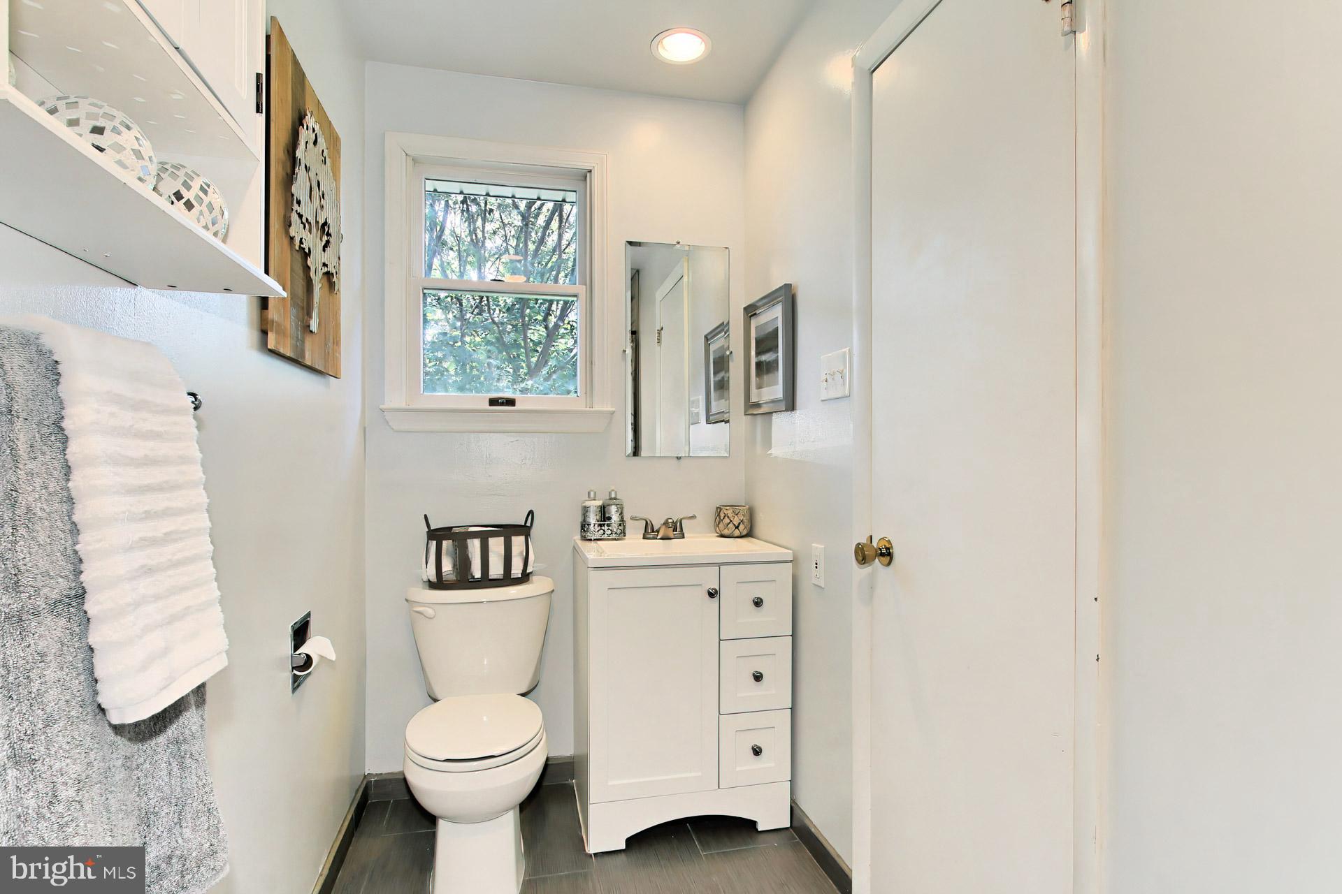 4123 Lees Corner Road Chantilly, VA 20151 - Photo 26 of 47 a white toilet sitting next to a bathroom sink