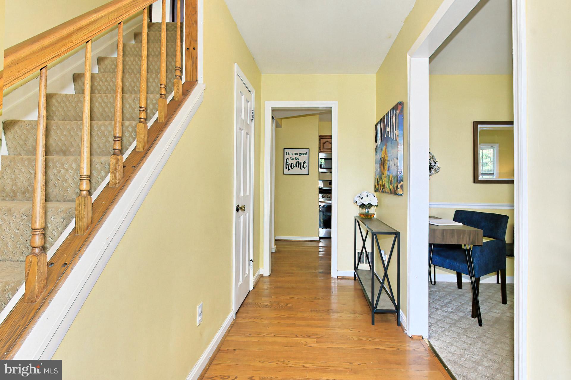 4123 Lees Corner Road Chantilly, VA 20151 - Photo 5 of 47 a view of a hallway with wooden floor and staircase