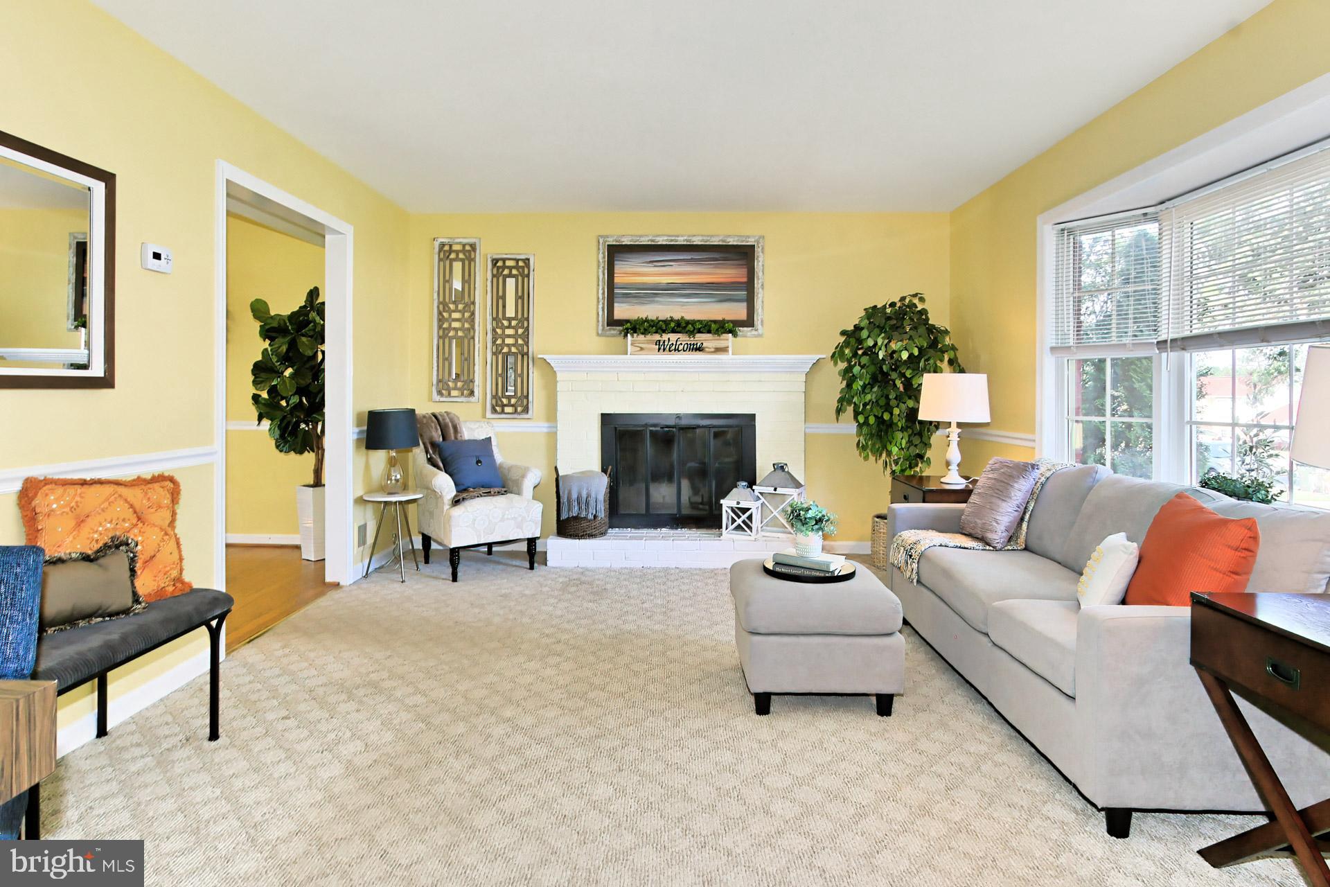 4123 Lees Corner Road Chantilly, VA 20151 - Photo 8 of 47 a living room with furniture a fireplace and a large window