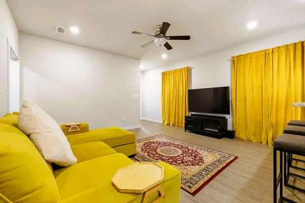 a living room filled with furniture and a couch