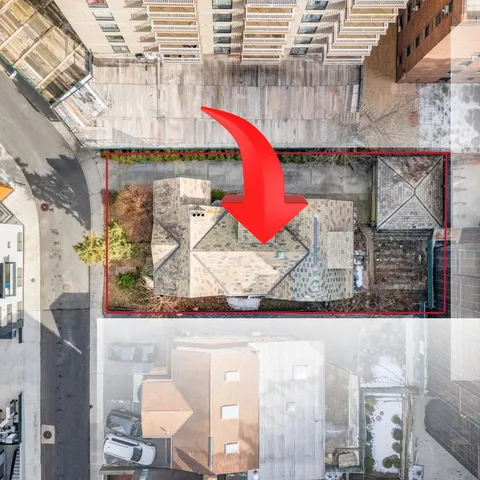 an aerial view of a house with outdoor space
