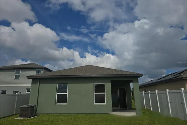 a kitchen with appliances a sink and cabinets