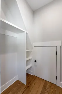 a view of an empty walk in closet