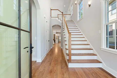 a view of staircase with white walls and windows