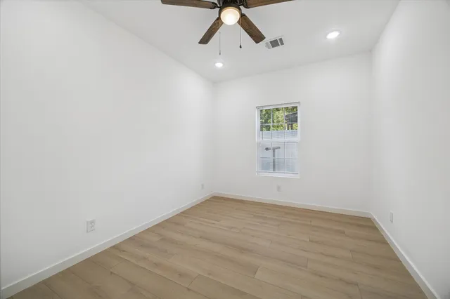 a view of room with window and ceiling fan