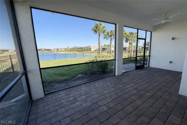 wooden floor fireplace and windows in a room