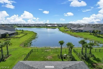 a view of multiple houses with a yard