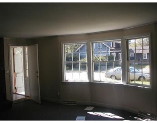 181 Seabrook Road, Unit 1 Barnstable, MA 02601 - Photo 2 of 8 a view of an empty room with a window