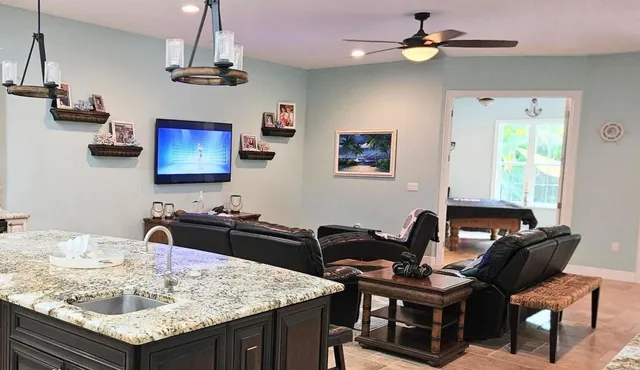 a view of a dining room with furniture and a large window