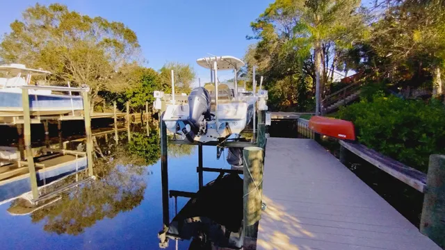 a view of a house with backyard porch and sitting area