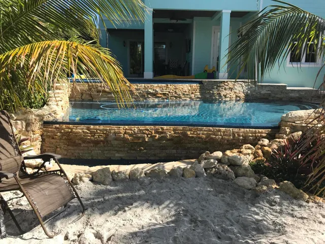 a view of a house with swimming pool