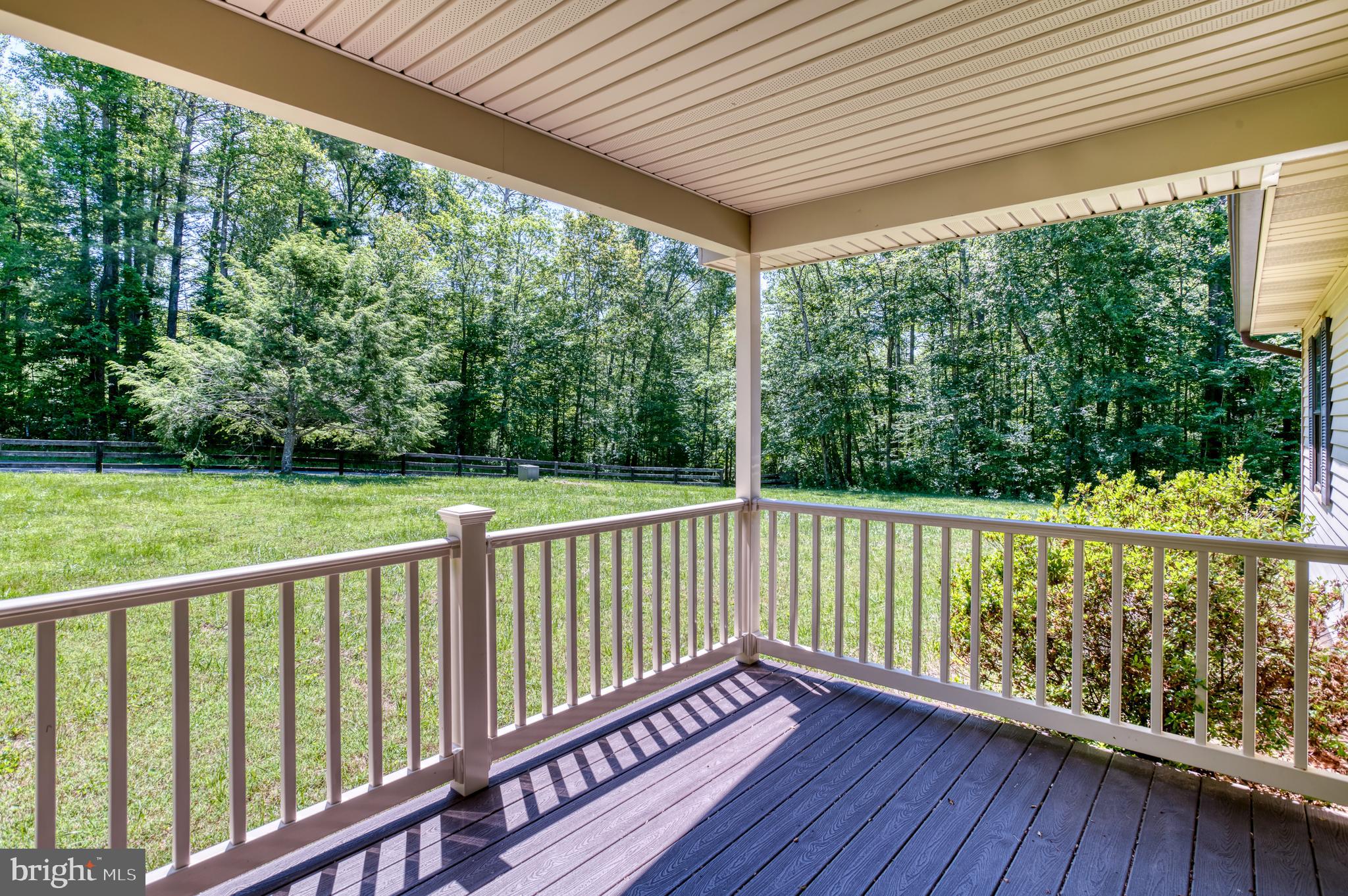 803 Weaver Hollow Road Banco, VA 22711 - Photo 21 of 67 a view of a wooden deck next to a yard