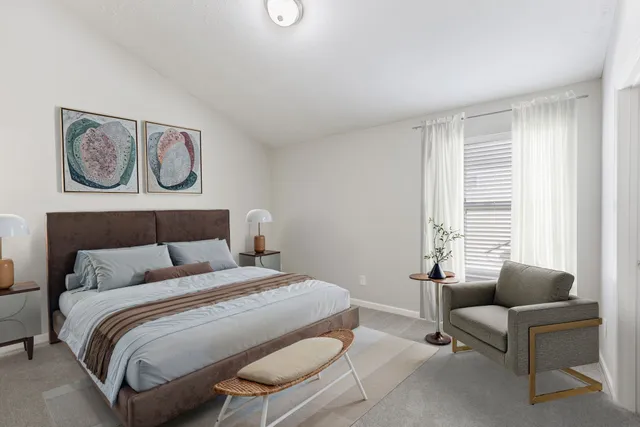 a bedroom with a bed and furniture