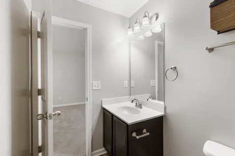 a bathroom with a sink a mirror and a shower