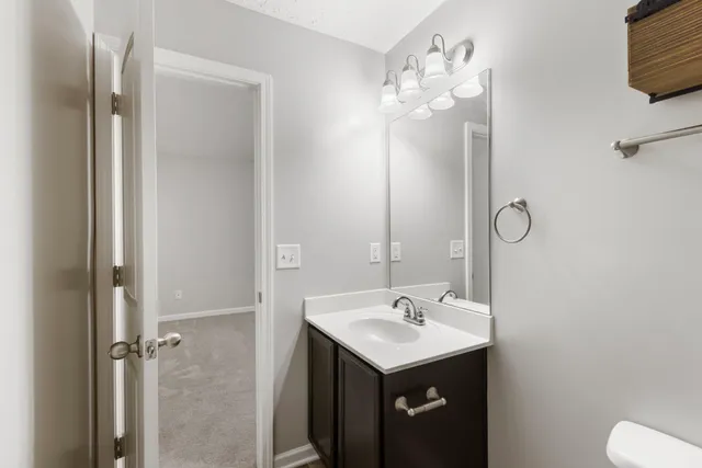 a bathroom with a sink a mirror and a shower