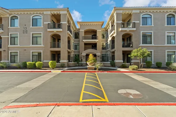 a view of a building with a swimming pool