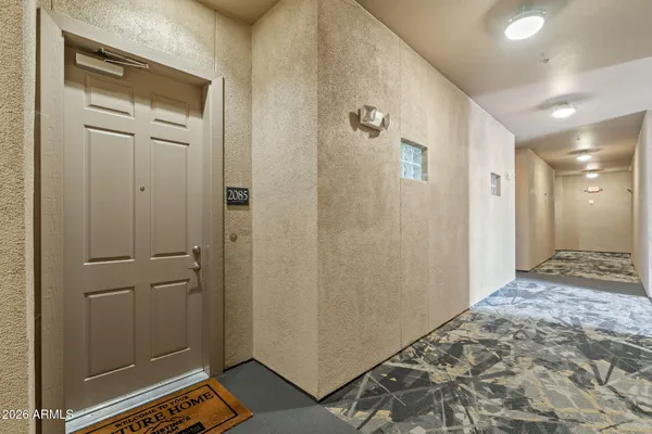 a bathroom with a shower and a sink
