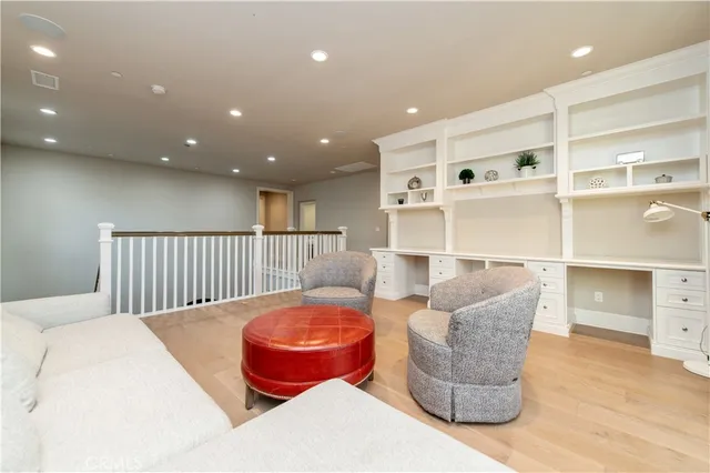 a bedroom with a bed and next to a window