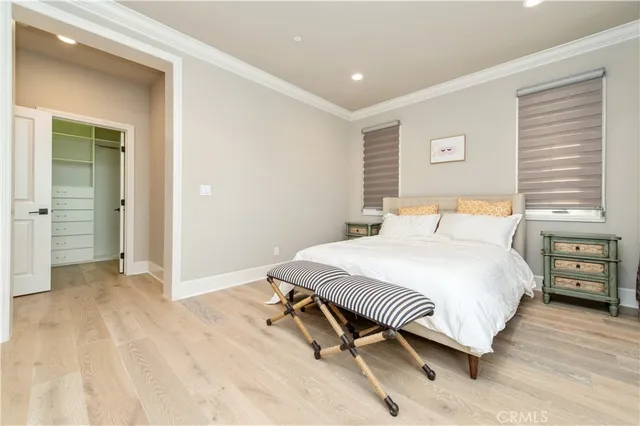 a bedroom with a bed and a cabinets