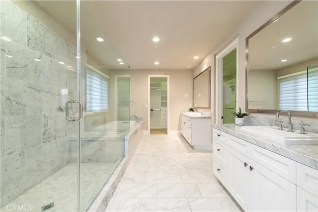 a view of walk in closet and window