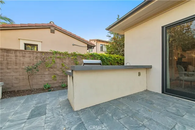 a view of a bench and chair in the patio