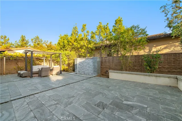a view of a chair and tables in the patio