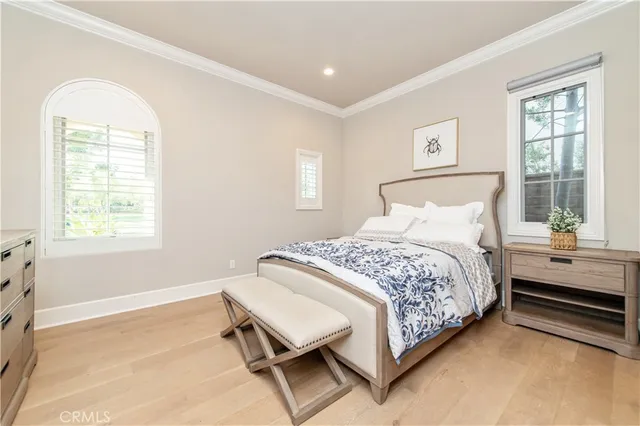 a bedroom with a bed and a night stand