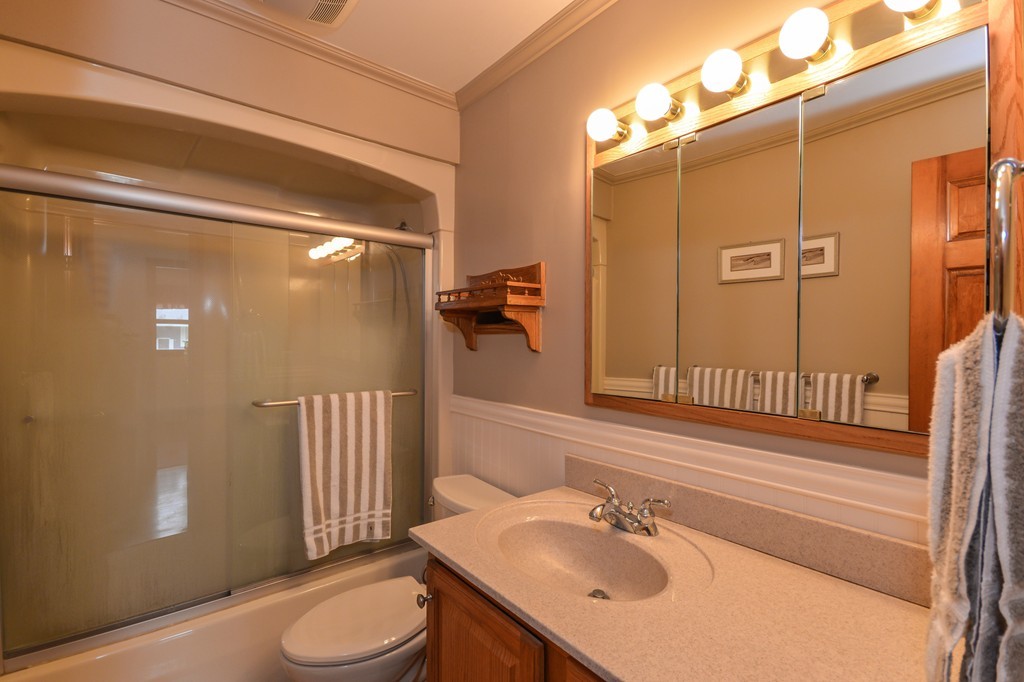 8 Quaker Circle Pembroke, MA 02359 - Photo 13 of 30 a bathroom with a sink a toilet and shower