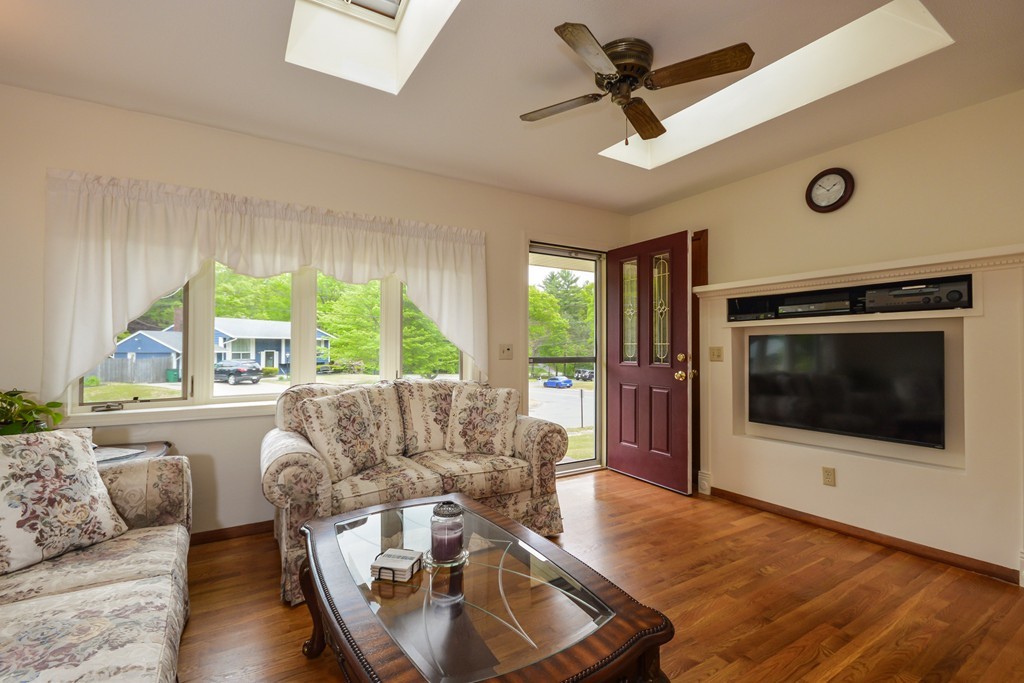 8 Quaker Circle Pembroke, MA 02359 - Photo 2 of 30 a living room with furniture and a flat screen tv