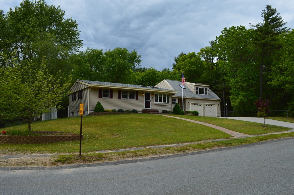 8 Quaker Circle Pembroke, MA 02359 - Photo 29 of 30 a front view of a house with a garden
