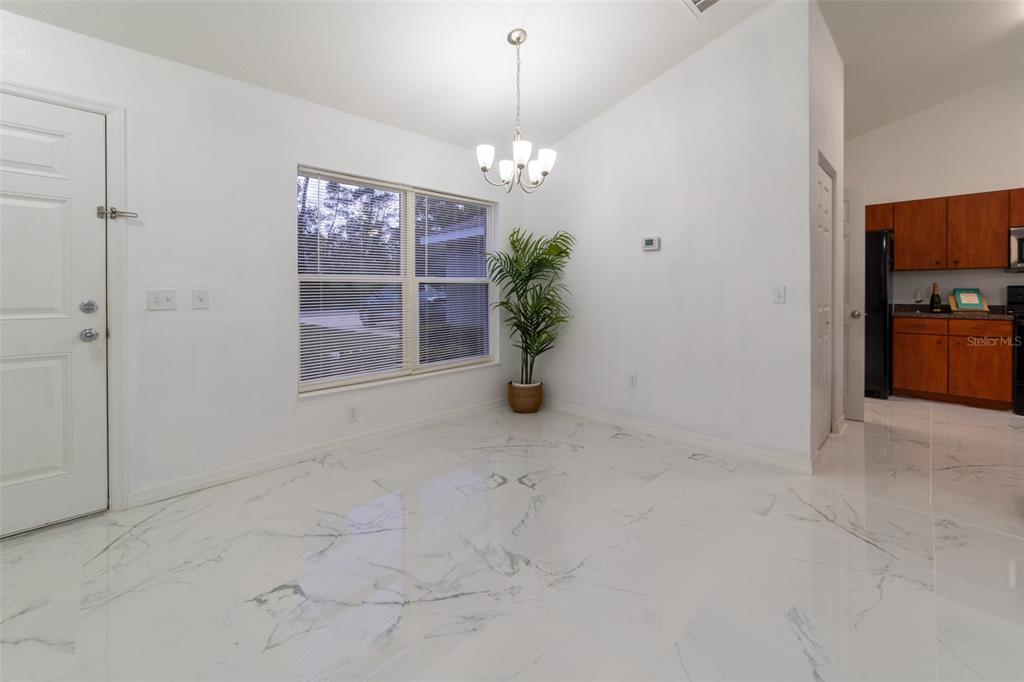 5107 Southwest 165th St Road Ocala, FL 34473 - Photo 3 of 34 a view of an empty room with a window