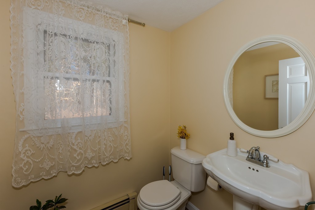 171 Taylor Road Stow, MA 01775 - Photo 8 of 18 a bathroom with a sink mirror and toilet