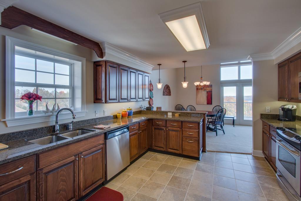 7100 Dale Ridge Road, Unit F5 Lancaster, TN 38569 - Photo 9 of 29 Granite countertops and travertine tile make your kitchen functional as well as pretty