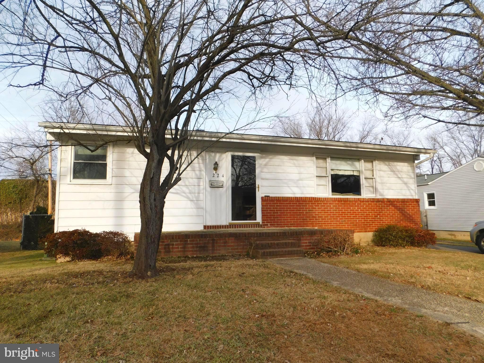 224 Cheddington Road Linthicum, MD 21090 - Photo 1 of 18 a front view of house with yard and trees around