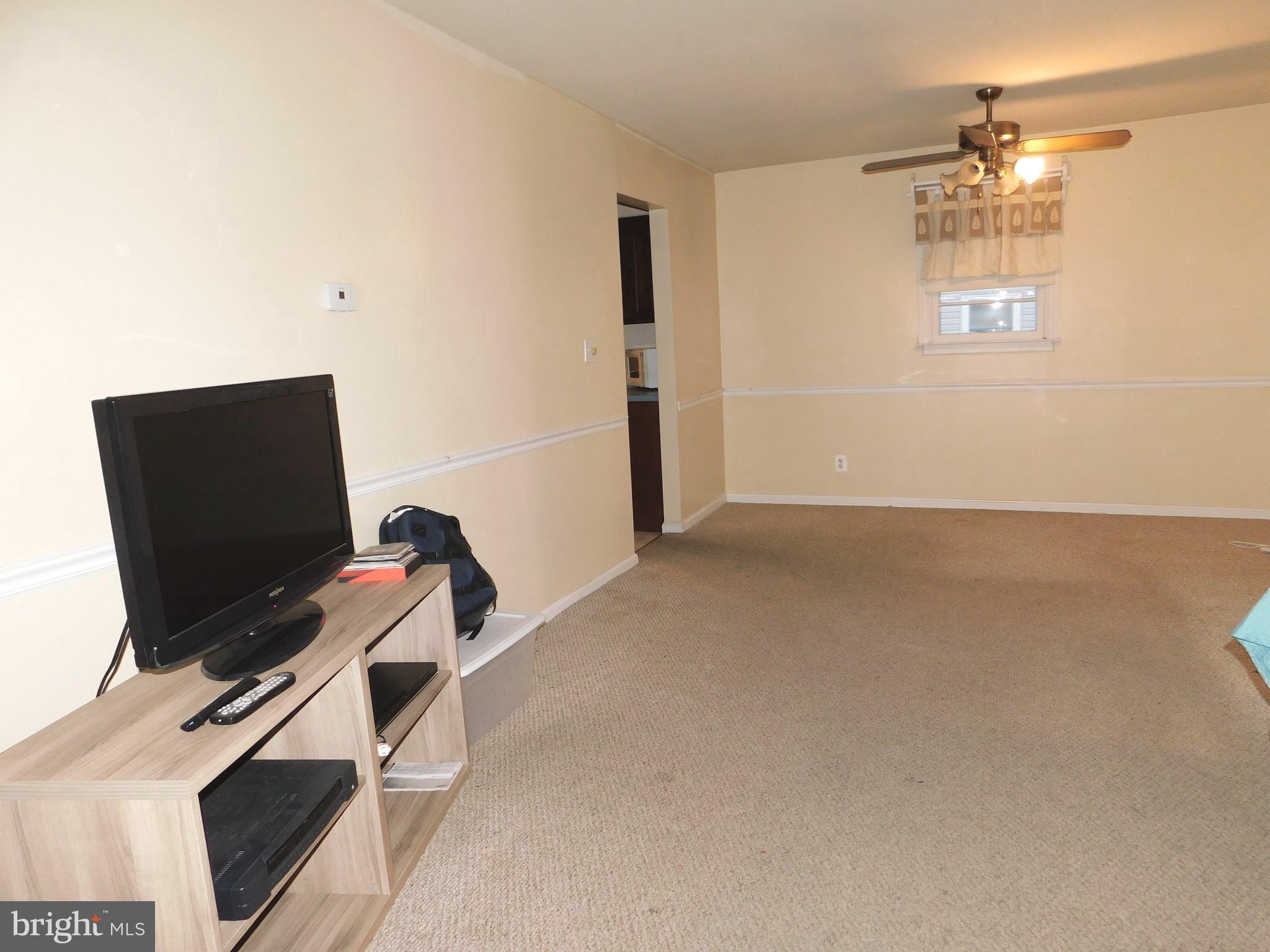 224 Cheddington Road Linthicum, MD 21090 - Photo 2 of 18 a view of a workspace with furniture