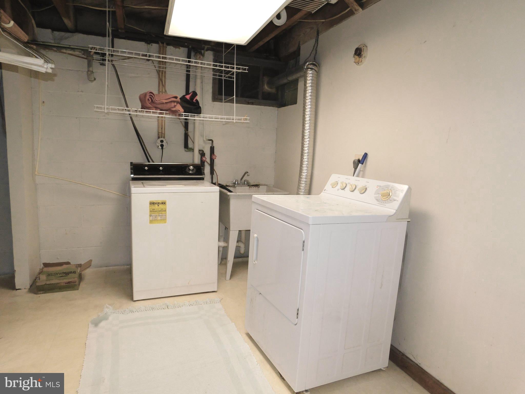 224 Cheddington Road Linthicum, MD 21090 - Photo 16 of 18 a utility room with dryer and washer