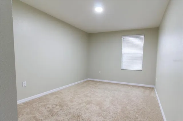 an empty room with a bathroom