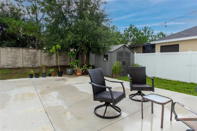 a view of a chairs and tables in patio