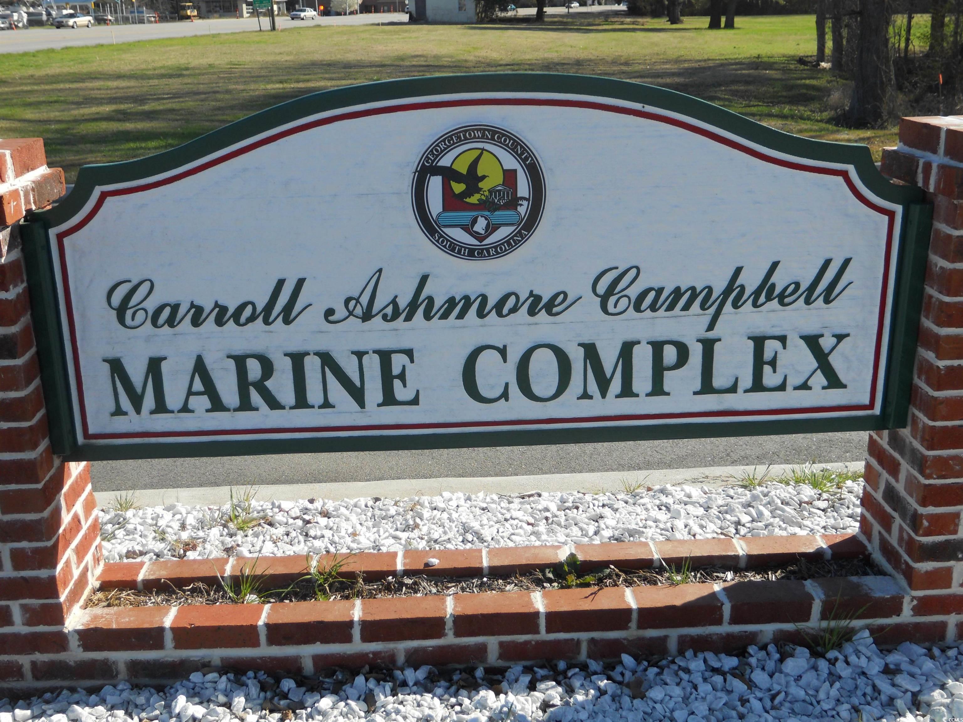 176 King George Lane Georgetown, SC 29440 - Photo 15 of 17 Community sign with a lawn