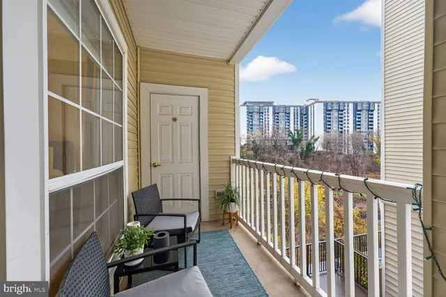 a view of a balcony with chairs