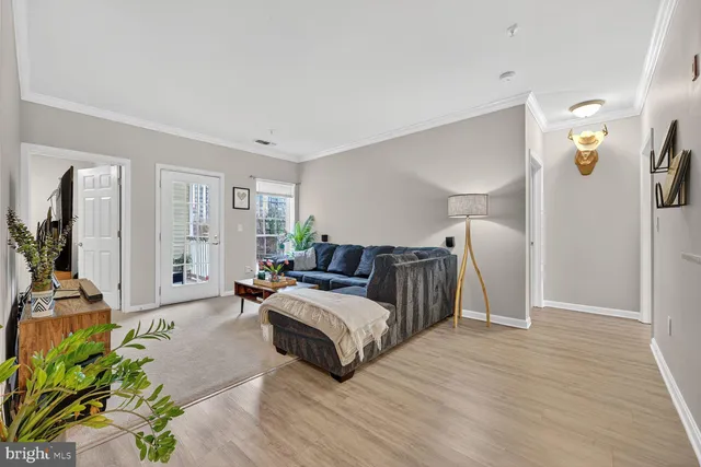 a spacious bedroom with a bed couch and a window