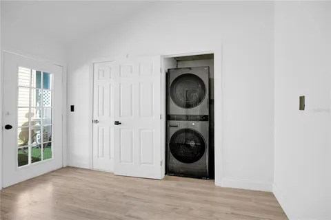 a view of a hallway with washer and dryer