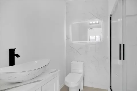 a bathroom with a toilet and a sink